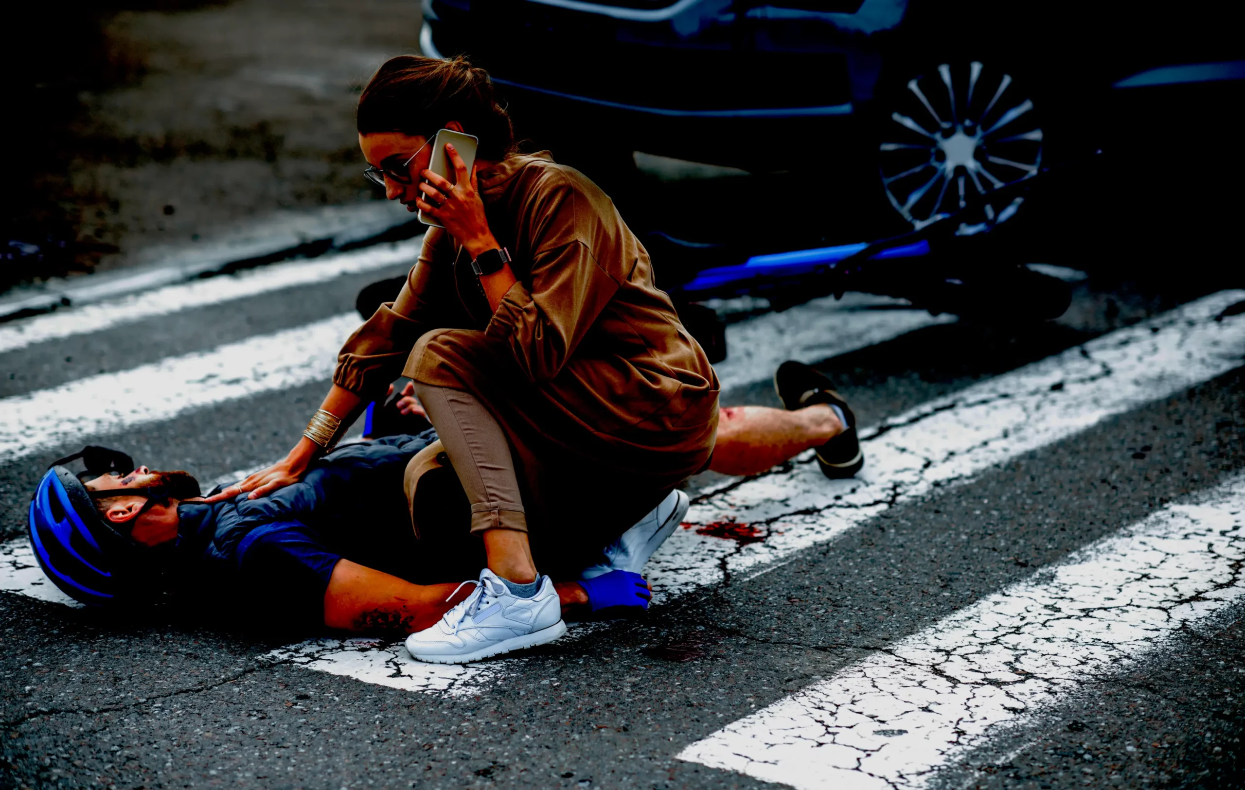 road accident with injured cyclist and car driver